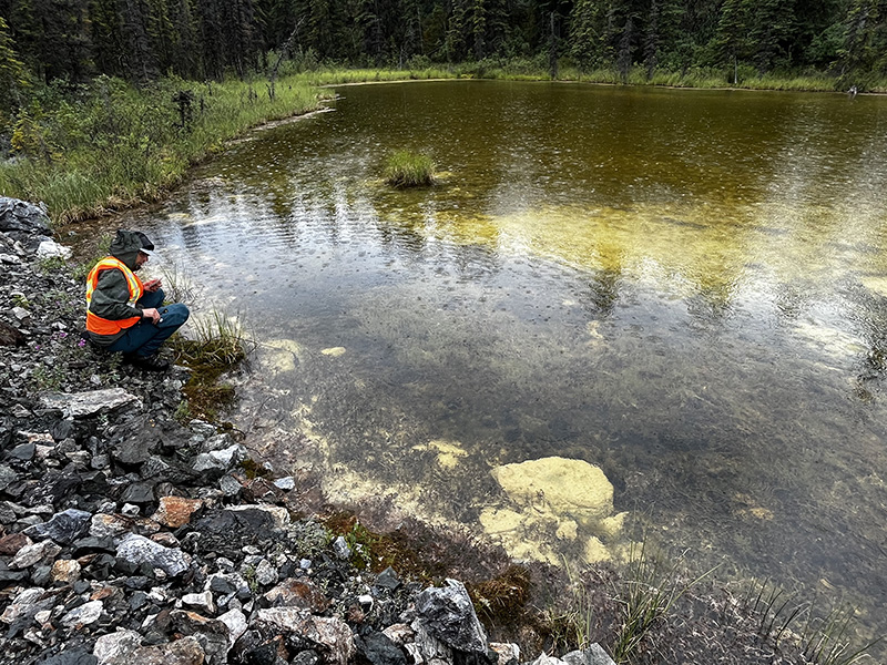 Sampling alkaline mine water drainage on the Whitehorse Copper Belt, Yukon, Canada.