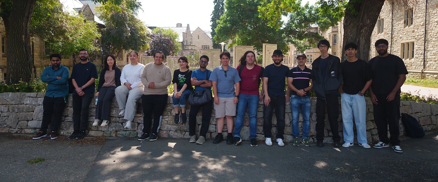 Members of the Ko Lab standing together outdoors on the University of Saskatchewan campus.
