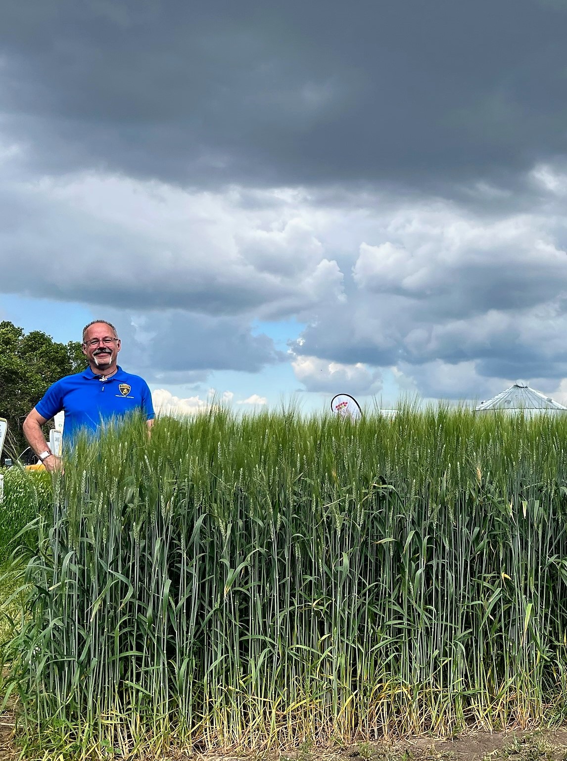 Dr. Smyth standing in a plot of CDC Credence durum, at the 2022 Ag in Motion